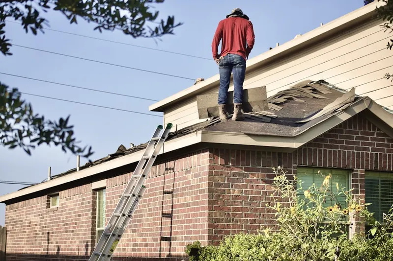 Professional roofer working on a residential roof in North Lake